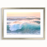 Textured abstract art print with vibrant orange and yellow hues on a silver-framed canvas, ideal for bedroom decor.