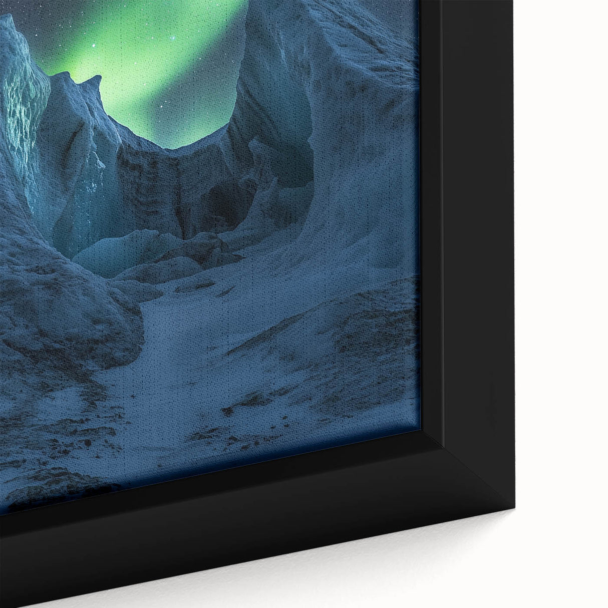 Close-up of a framed canvas depicting dramatic cliffs in a vibrant landscape, showcasing rich colors and intricate details, perfect for home decor and art enthusiasts.