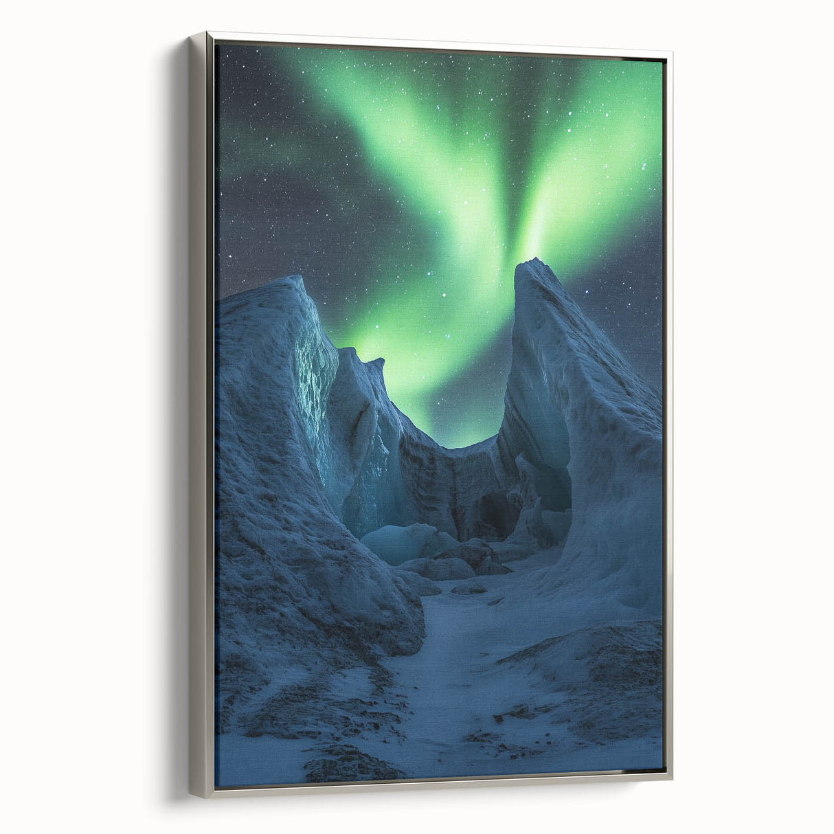 Framed canvas artwork depicting a stunning landscape with dramatic cliffs, showcasing a silver frame and a side view that highlights its elegant design, perfect for home decor.