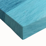 Close-up of a stretched canvas artwork depicting a serene beach landscape, showcasing vibrant blues and soft sandy tones, perfect for home decor and relaxation themes.