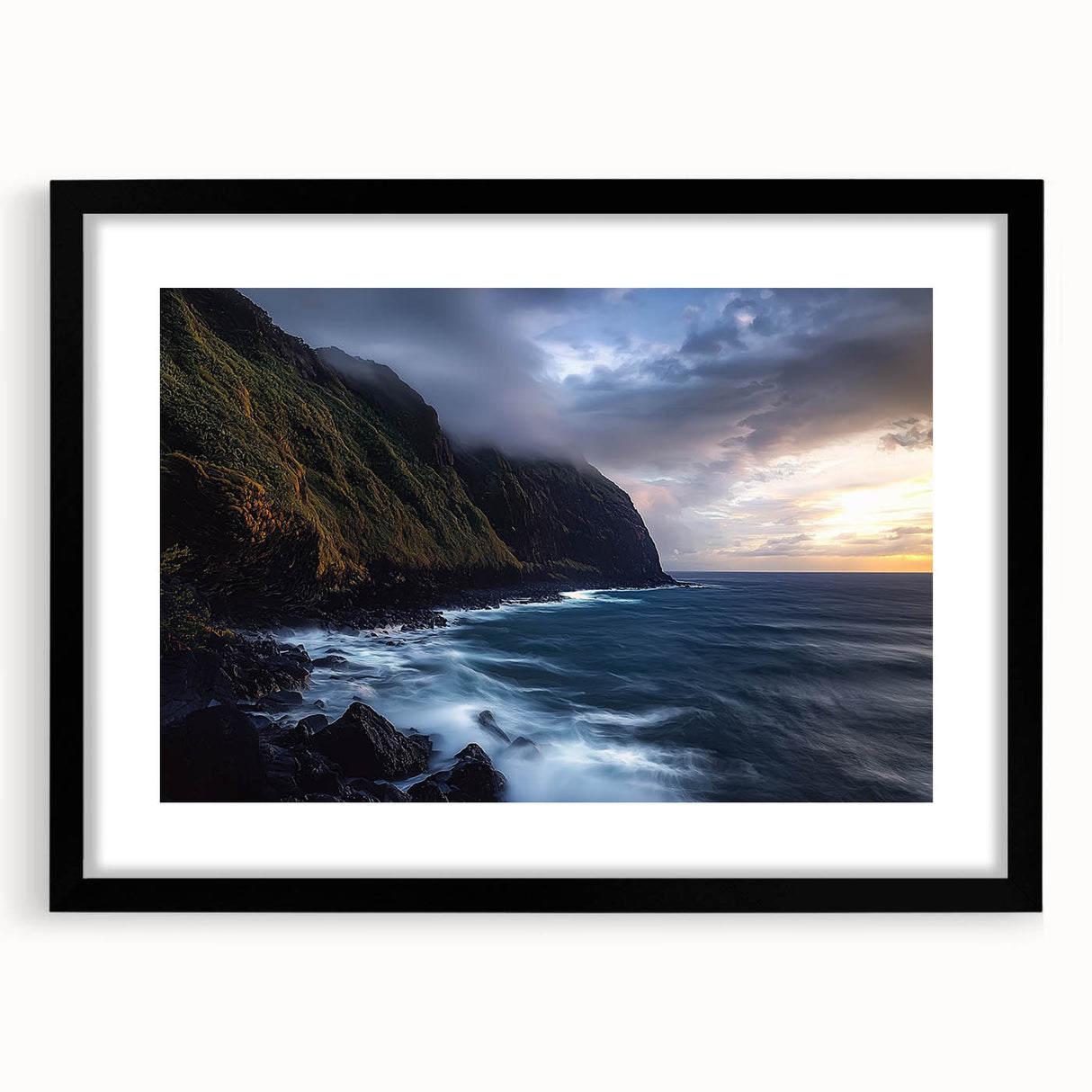 Black-framed landscape artwork showcasing dramatic cliffs and serene skies, designed with a white mat for an elegant presentation. Perfect for home decor and gallery displays.