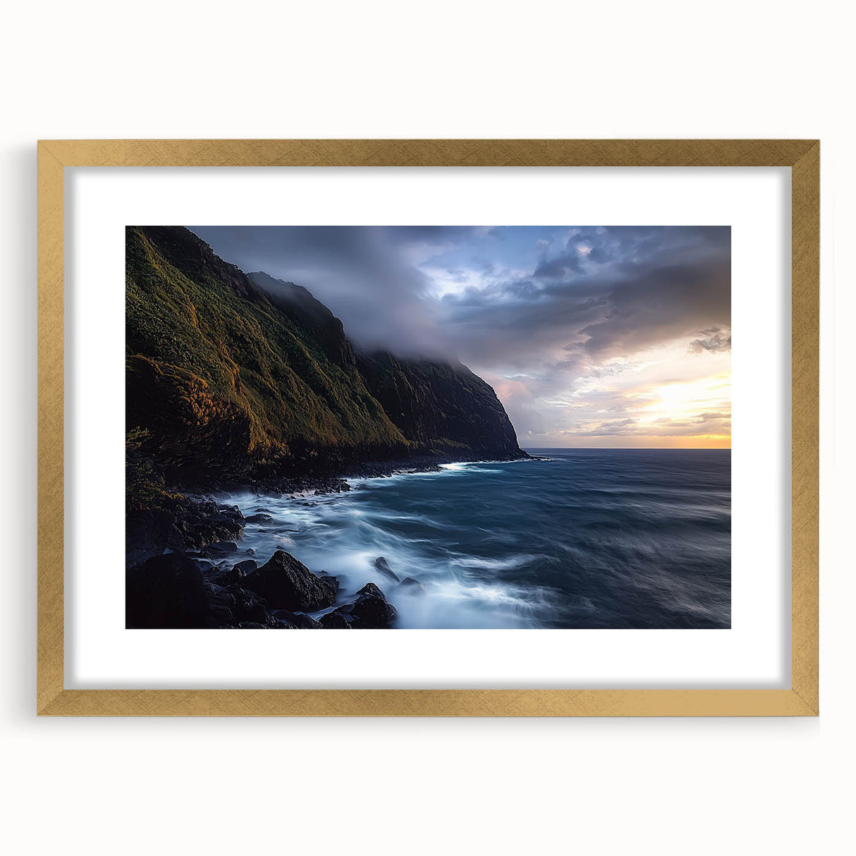 Framed landscape artwork depicting dramatic cliffs in vibrant colors, featuring a gold mat and frame, perfect for enhancing home decor with a natural touch.