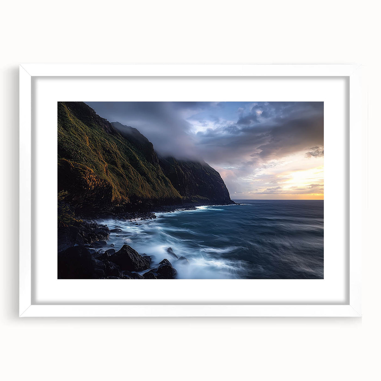 Framed landscape artwork depicting dramatic cliffs with a white mat, showcasing earthy tones and intricate textures, perfect for enhancing home décor.