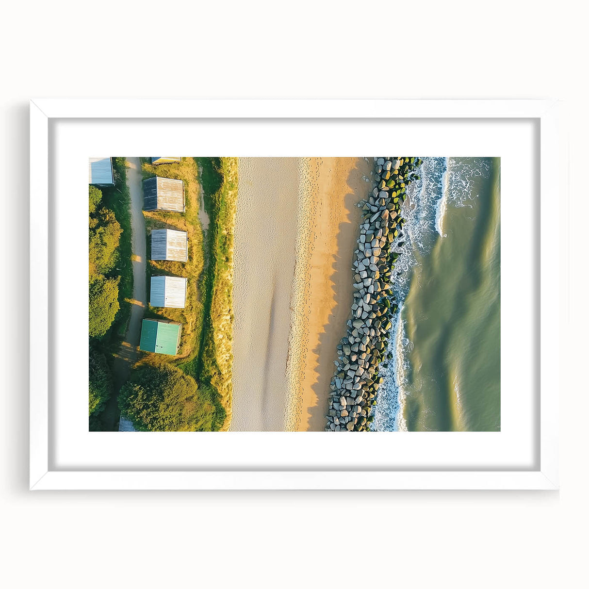 Landscape artwork featuring a serene beach scene framed with a clean white mat, ideal for coastal decor. This piece adds a calming touch to any living space, perfect for beach lovers.