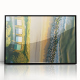 Framed acrylic artwork depicting serene beach landscape with vibrant colors, showcased in a sleek black frame, ideal for home decor enhancement.