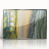 Framed acrylic artwork depicting a serene beach landscape with soft waves and a clear blue sky, showcasing vibrant colors and intricate details, perfect for coastal decor.
