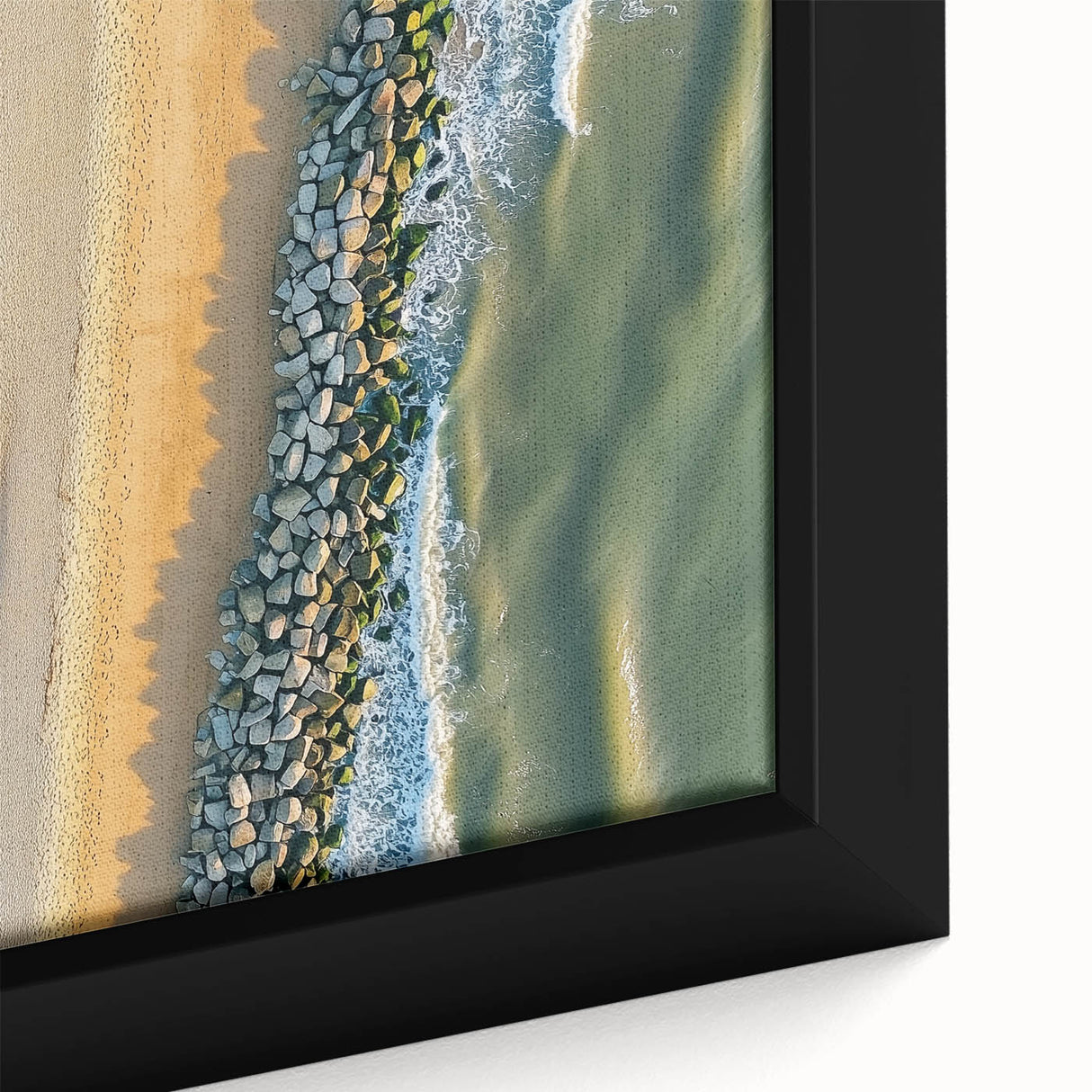 Close-up of a framed landscape canvas showcasing a vibrant beach scene with gentle waves and golden sand, ideal for coastal home decor. Perfect for adding a serene touch to any room.