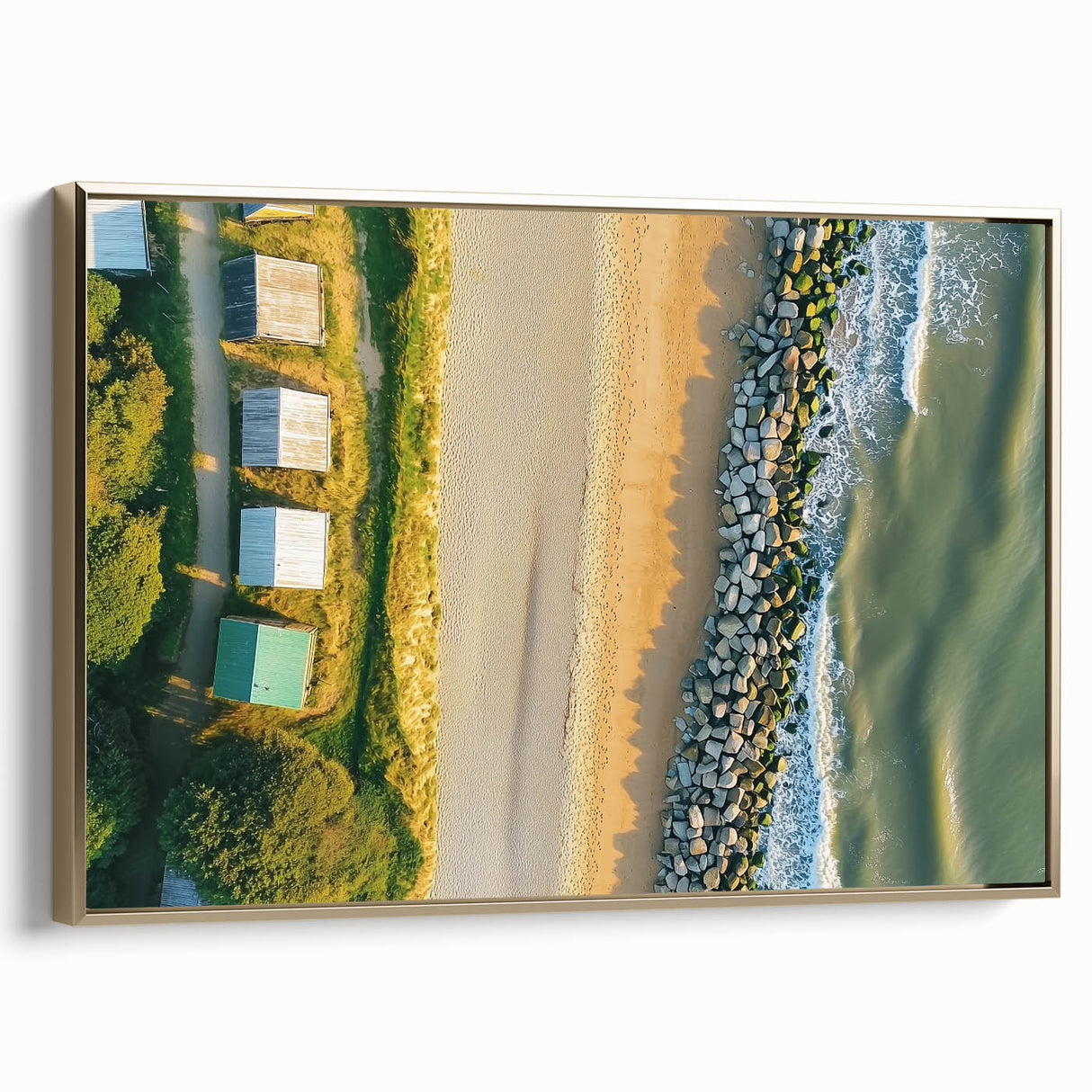 Framed canvas artwork depicting a serene beach landscape with golden accents, showcasing gentle waves and soft sand, perfect for coastal home decor.