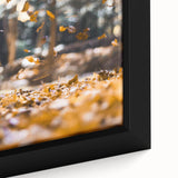 Close-up of a framed canvas featuring textured, colorful autumnal trees on a black background, ideal for living room decor.