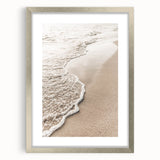 Textured abstract art print in silver frame, featuring soft white and gray tones, ideal for bedroom decor.