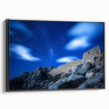 Framed canvas artwork showcasing a stunning landscape with dramatic cliffs, presented in a sleek black frame, perfect for enhancing home decor aesthetics.