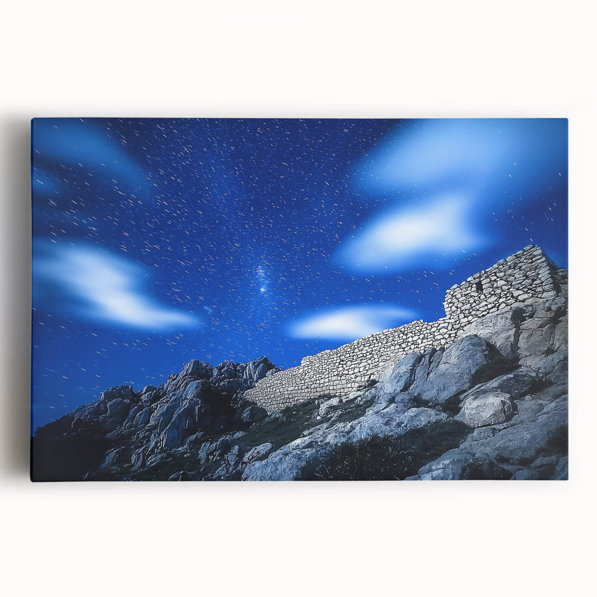 Stretched canvas art depicting a breathtaking landscape of rugged cliffs under a vibrant sunset, showcasing rich colors and dramatic textures, ideal for home decor.
