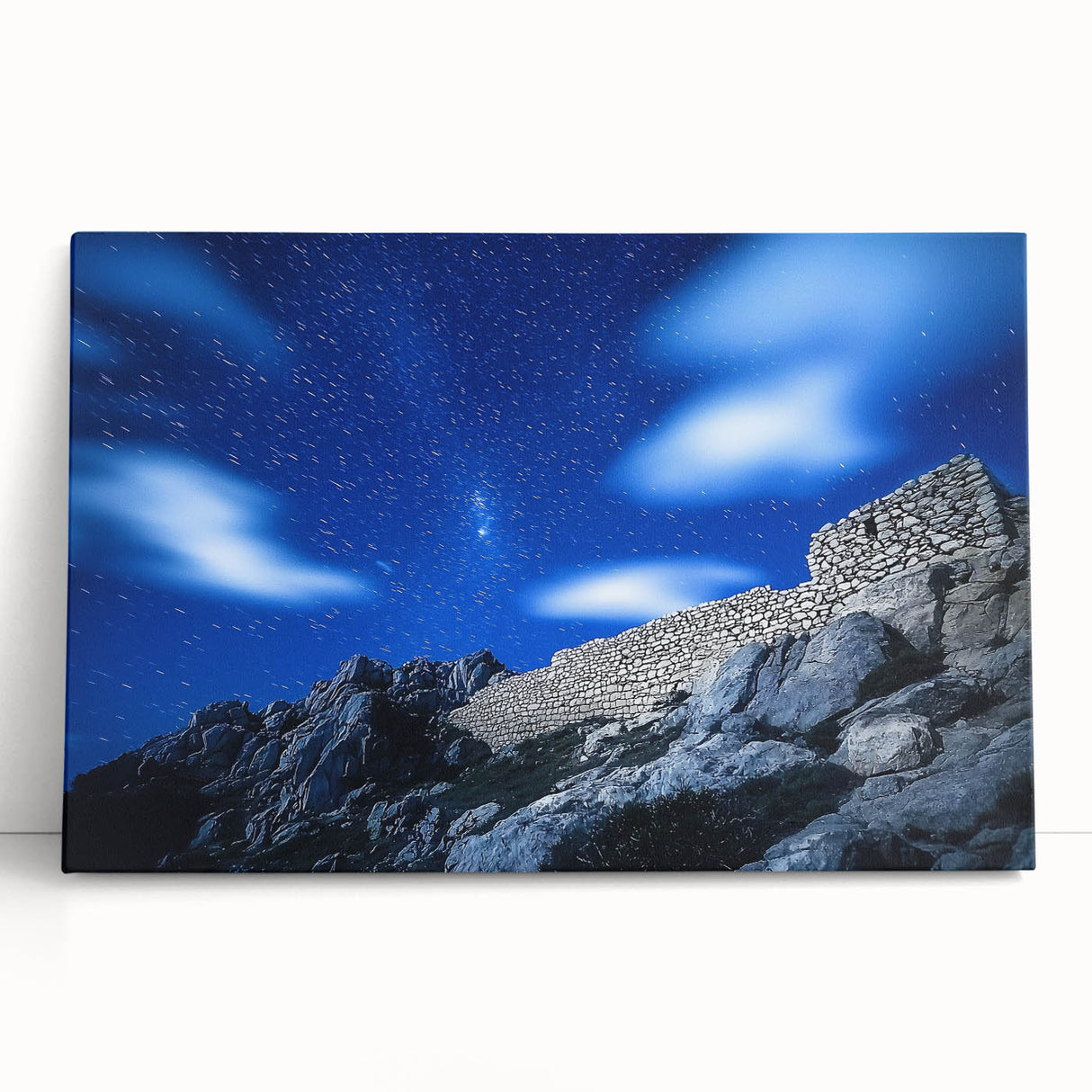 Stretched canvas artwork showcasing a dramatic landscape of rugged cliffs under a vibrant sunset, perfect for enhancing modern home decor with natural beauty.