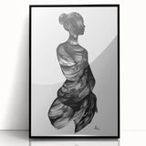 Framed abstract figurative artwork in black acrylic, showcasing modern design elements and a sleek front view, perfect for contemporary home decor.