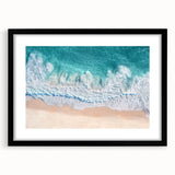 Landscape beach art print in a sleek black frame with a white mat, showcasing serene ocean waves and sandy shores, perfect for coastal-themed decor.