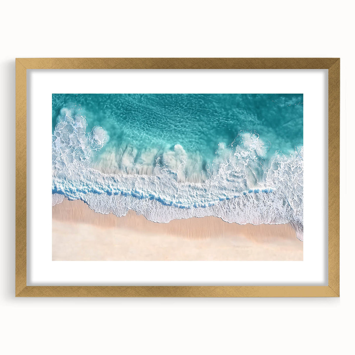Elegant gold-framed landscape artwork depicting serene beach scene with gentle waves and blue skies, ideal for home decor and coastal-themed interiors.