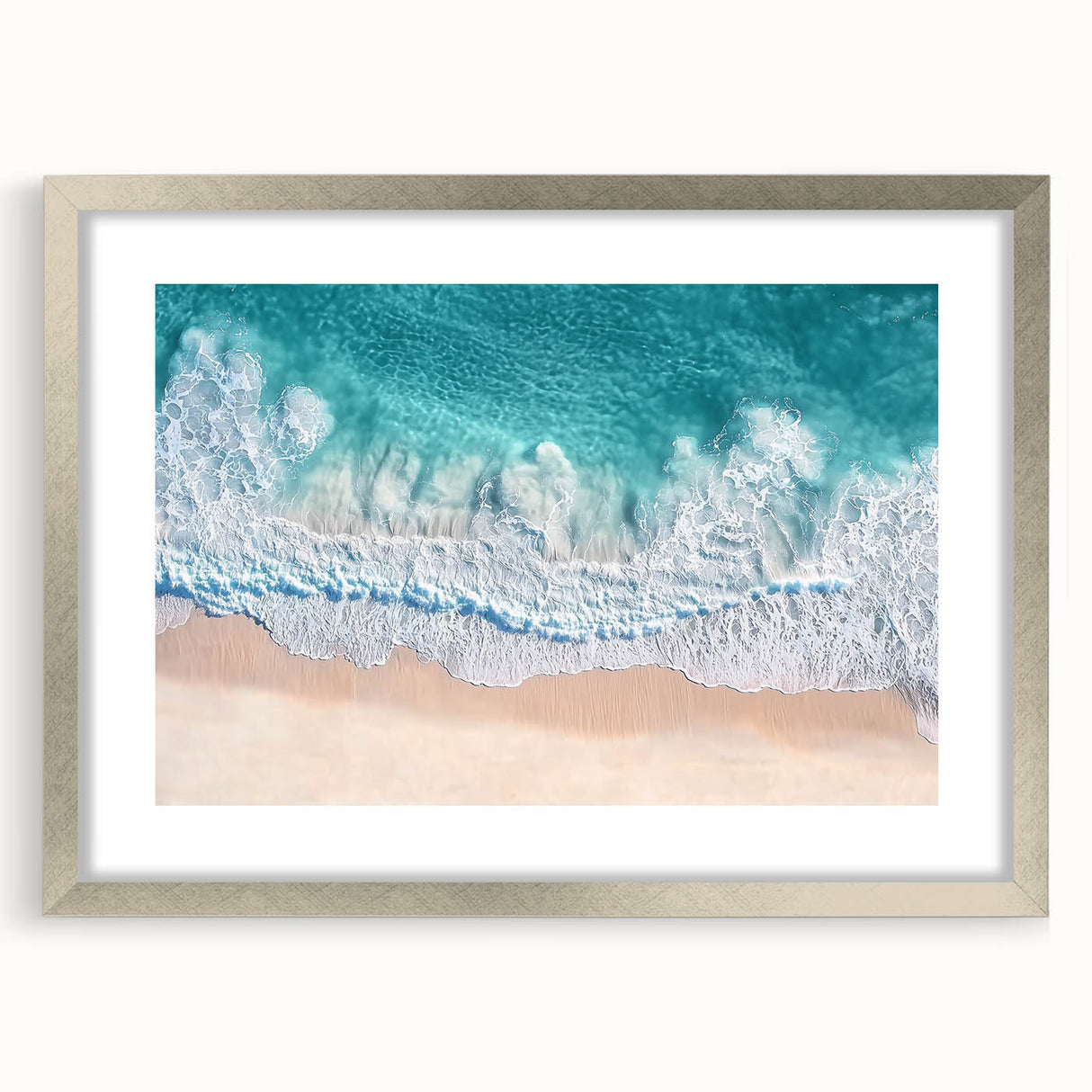 Elegant silver-framed landscape artwork featuring a serene beach scene with soft waves and a clear blue sky, perfect for home decor or office ambiance.