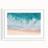 Framed landscape artwork depicting serene beaches with a white mat, showcasing soft blue skies and gentle waves, perfect for coastal-themed decor.