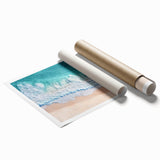 Vibrant rolled print showcasing a serene beach landscape with soft waves and golden sand, elegantly packaged in a protective cardboard tube for easy display.