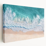 Stretched canvas artwork depicting a vibrant beach landscape in warm hues, showcasing rolling waves and palm trees, ideal for coastal home decor.