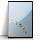 Large abstract wall art depicting summer season in vibrant yellows and greens on a black framed acrylic.