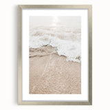 Textured art print featuring abstract swirls in muted gray and silver tones, displayed in a silver frame.