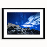 Black-framed landscape artwork showcasing dramatic cliffs with a mat border, perfect for enhancing home decor in modern or rustic settings.