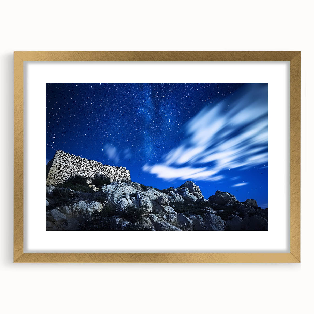 Elegant gold-framed landscape artwork showcasing dramatic cliffs, mounted with a white mat for a polished look. Ideal for enhancing modern home decor or gallery walls.