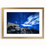 Elegant gold-framed landscape artwork showcasing dramatic cliffs, mounted with a white mat for a polished look. Ideal for enhancing modern home decor or gallery walls.
