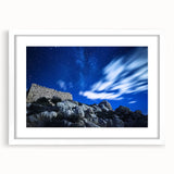 Framed landscape artwork showcasing dramatic cliffs against a serene sky, featuring a white mat and sleek frame, ideal for enhancing modern home decor.
