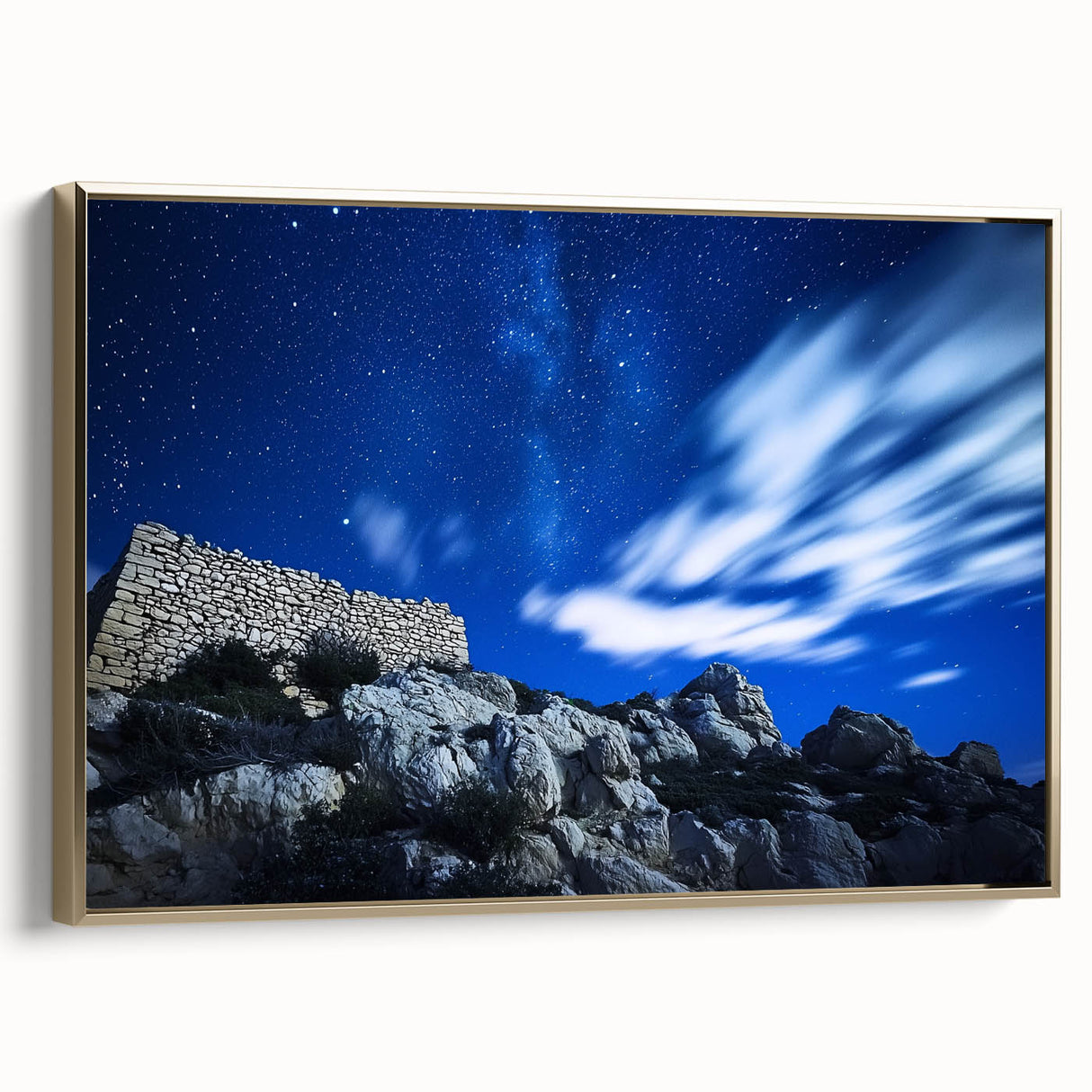 Framed canvas artwork showcasing a breathtaking landscape of rugged cliffs in a gold frame, ideal for enhancing modern home decor with its natural beauty.