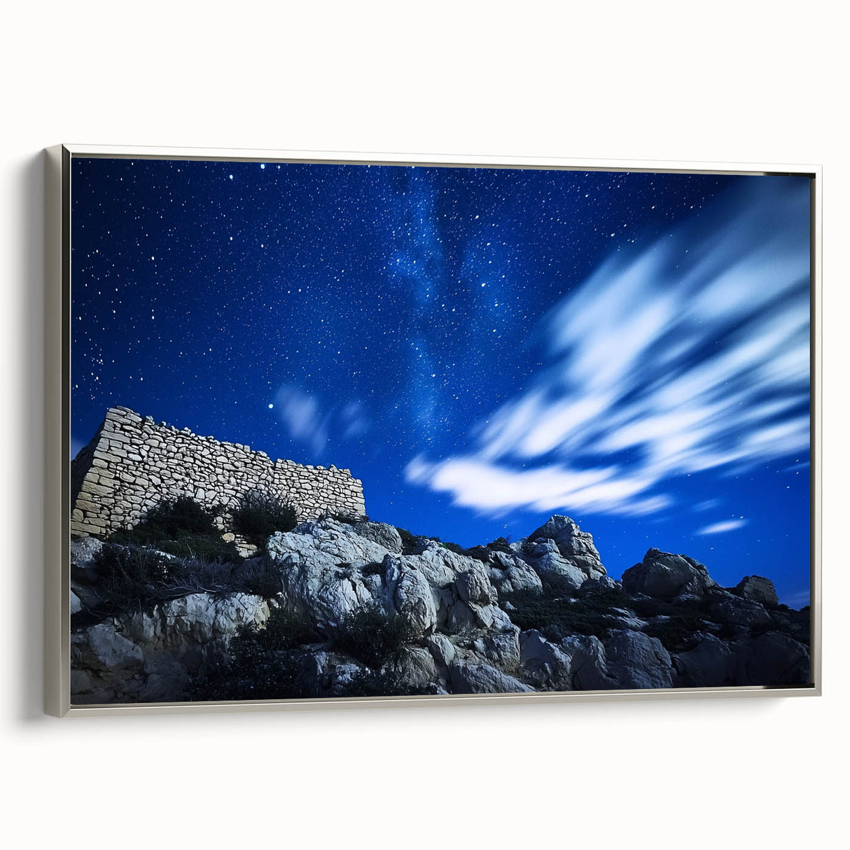 Framed canvas artwork showcasing stunning cliff landscapes with vibrant colors and intricate details, featuring a sleek silver frame, ideal for home decor.