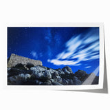 Vibrant rolled print of rugged cliffs landscape, showcasing dramatic rock formations and deep blue skies, ideal for home decor or art enthusiasts.