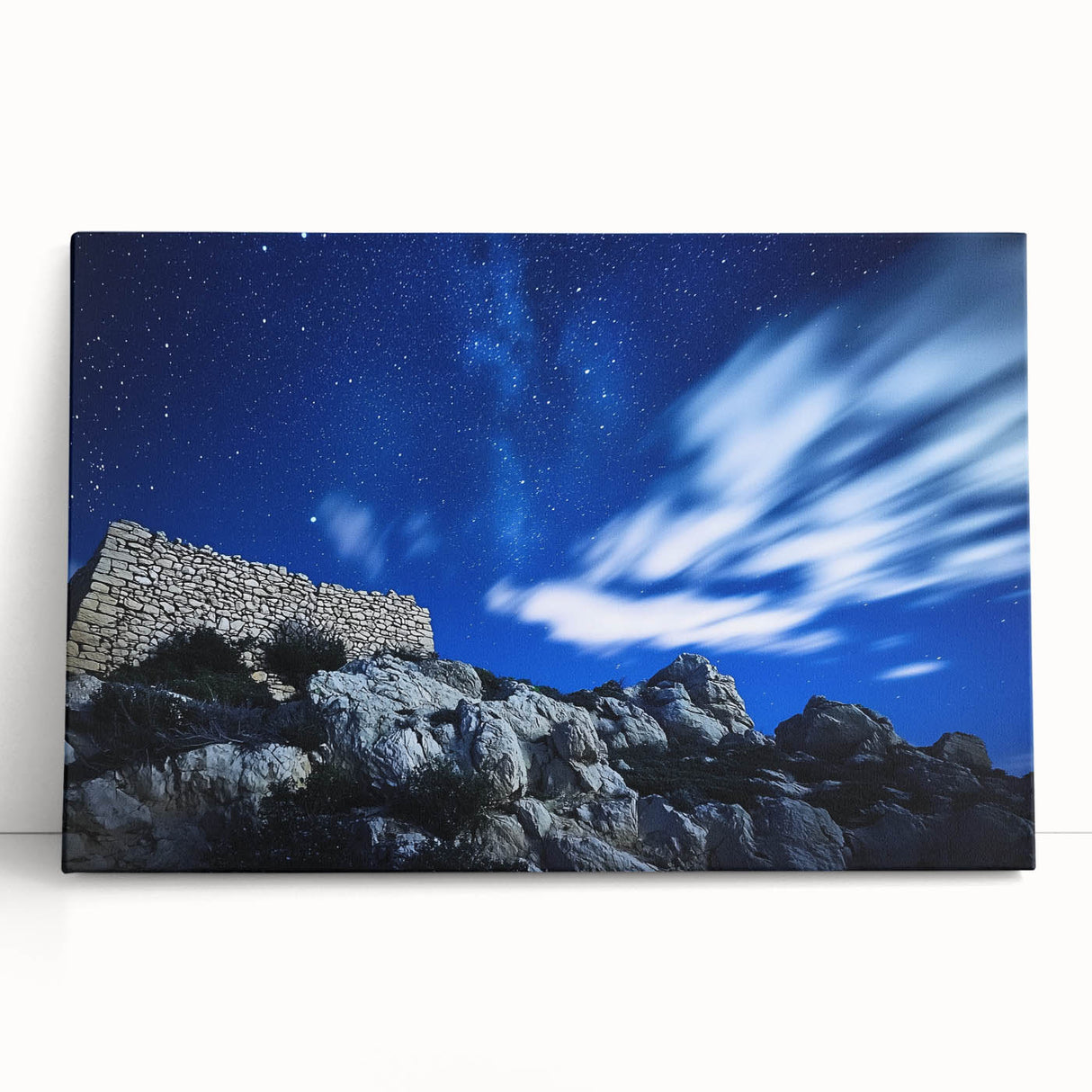 Stretched canvas artwork depicting a stunning landscape of rugged cliffs under a vibrant sunset, showcasing rich colors and intricate details, perfect for home decor.