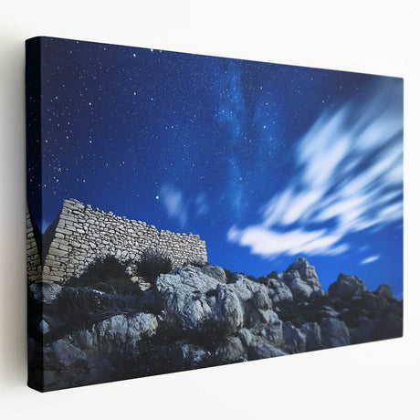 Side view of a stretched canvas depicting dramatic cliffs and a vibrant landscape, showcasing rich colors and detailed textures, perfect for enhancing home decor.