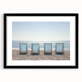 Black frame showcasing a landscape beach print with a white mat, perfect for coastal decor. Ideal for enhancing living spaces with a serene ocean view.