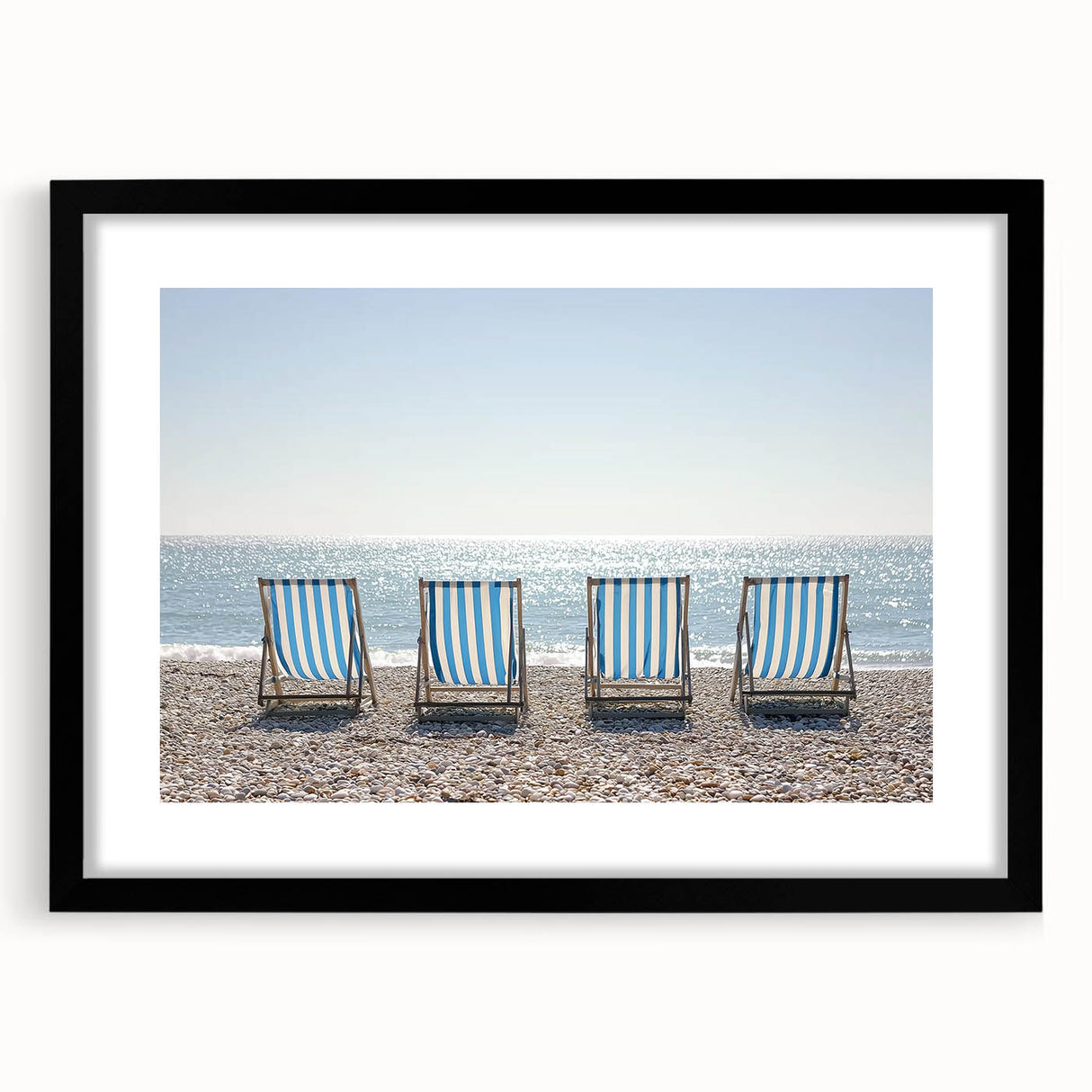 Black frame showcasing a landscape beach print with a white mat, perfect for coastal decor. Ideal for enhancing living spaces with a serene ocean view.