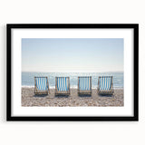 Black frame showcasing a landscape beach print with a white mat, perfect for coastal decor. Ideal for enhancing living spaces with a serene ocean view.