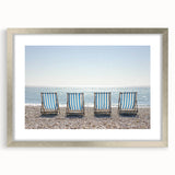 Silver-framed landscape art print showcasing a serene beach scene, complete with a white mat, ideal for coastal-themed home decor or beach house interiors.