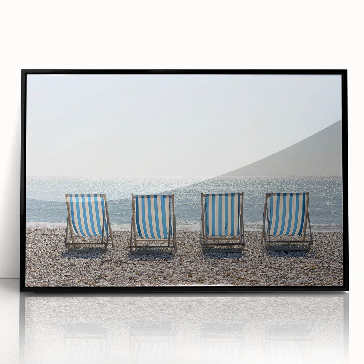 Framed acrylic artwork showcasing a serene beach landscape with vibrant colors, set against a sleek black frame, perfect for coastal-themed decor.