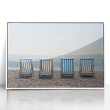 Framed acrylic artwork showcasing a vibrant beach landscape with soft waves and a clear blue sky, mounted in a sleek white frame, perfect for coastal decor.