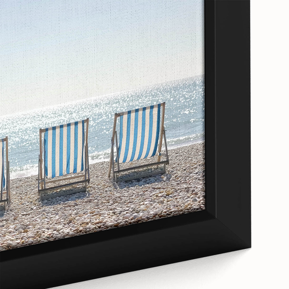 Framed landscape canvas artwork showcasing a serene beach scene with gentle waves and soft golden sands, ideal for coastal home decor and relaxation themes.