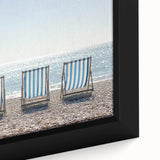 Framed landscape canvas artwork showcasing a serene beach scene with gentle waves and soft golden sands, ideal for coastal home decor and relaxation themes.
