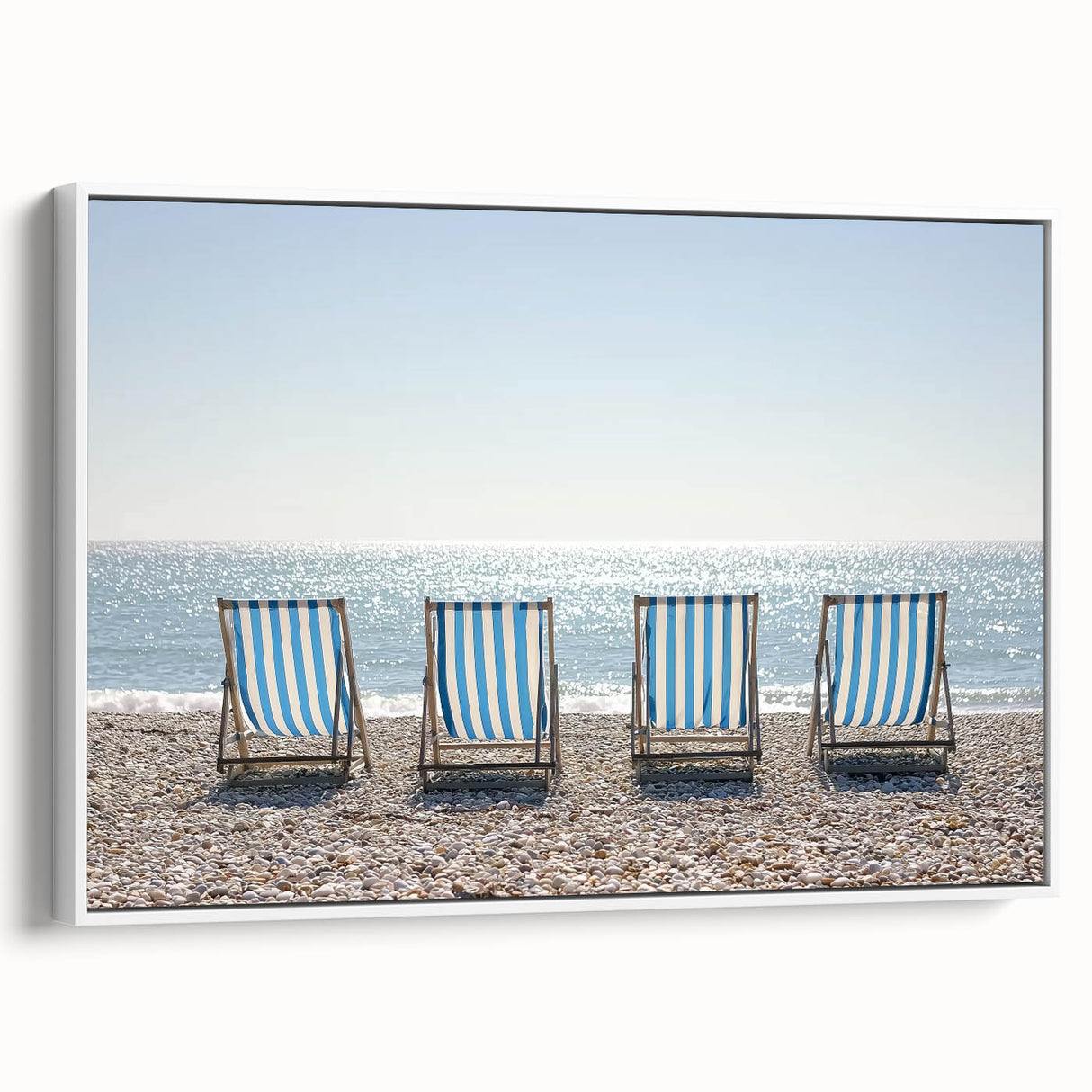 Framed canvas artwork depicting a serene beach landscape with vibrant colors and gentle waves, presented in a sleek white frame, enhancing any coastal decor.