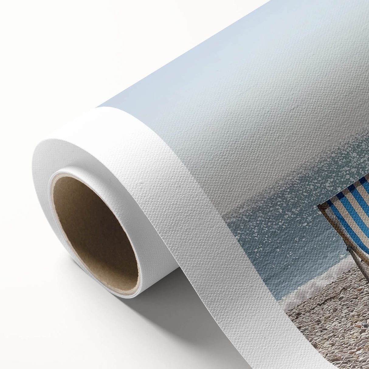 Vibrant rolled canvas art depicting a serene beach landscape with soft waves, blue skies, and golden sands, ideal for coastal-themed decor and interior design.