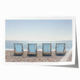 Stunning landscape print of a serene beach scene featuring soft waves lapping at the shore under a vibrant sunset, rolled for easy framing and display.