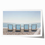 Stunning landscape print of a serene beach scene featuring soft waves lapping at the shore under a vibrant sunset, rolled for easy framing and display.