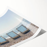 Stunning landscape artwork print showcasing serene beach scenery with vibrant blue skies, soft sands, and gentle waves, rolled for easy transport and display.