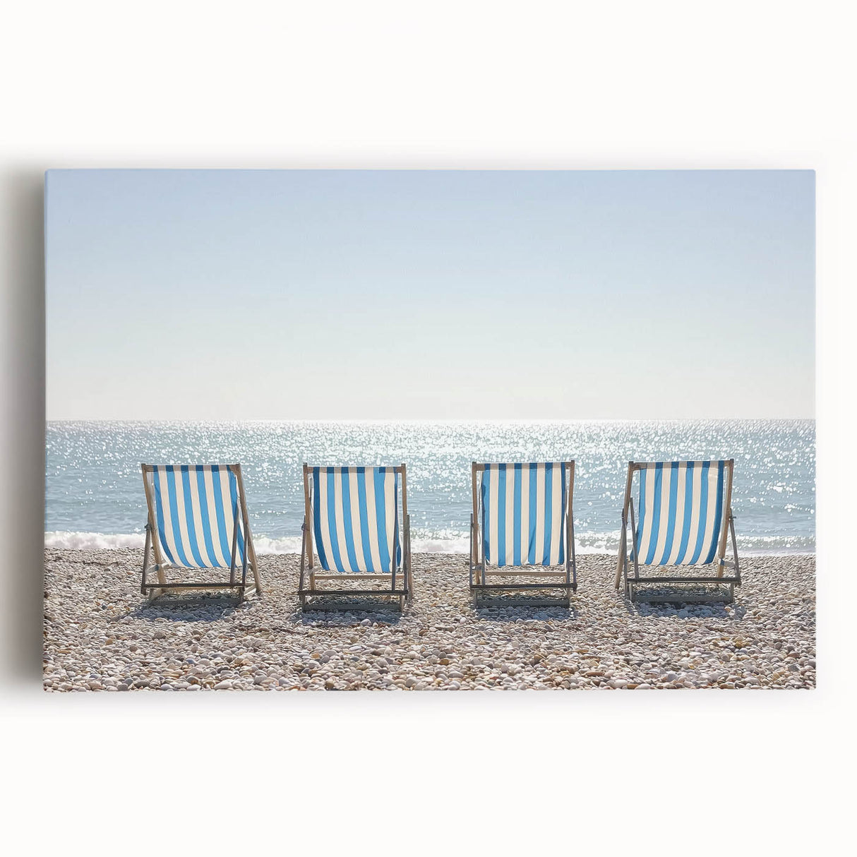 Vibrant canvas art depicting a serene beach landscape with gentle waves and a colorful sunset, ideal for enhancing coastal-themed decor in homes or offices.