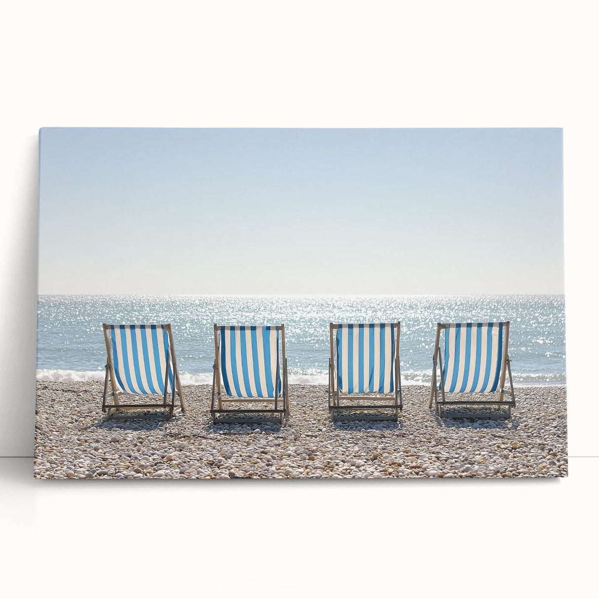 Stretched canvas artwork showcasing a serene beach landscape, featuring soft pastel hues and gentle waves, perfect for coastal-themed home decor or relaxation spaces.